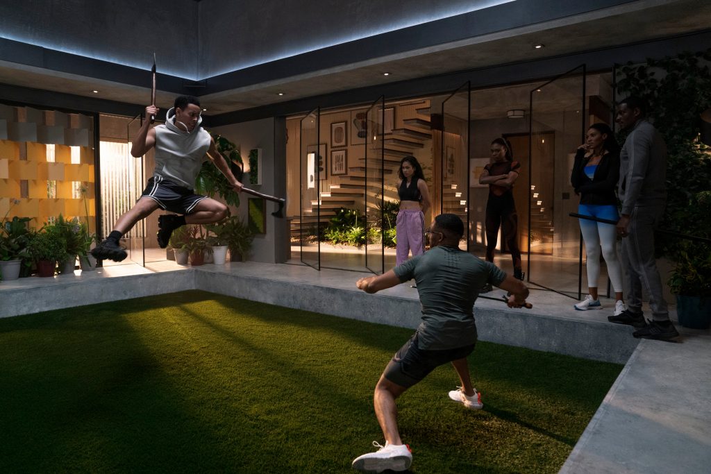 First Kill. (L to R) Dominic Goodman as Apollo Burns, Walnette Santiago as Carmen, Phillip Mullings Jr. as Theo Burns, Imani Lewis as Calliope, Aubin Wise as Talia Burns, Jason R. Moore as Jack Burns in episode 103 of First Kill. Cr. Brian Douglas/Netflix © 2022